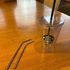 Used Starbucks plastic cup and 2 metal straws
